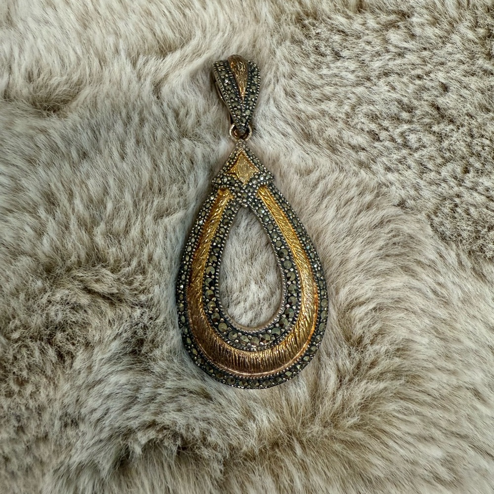 Elegant Gold and Silver Teardrop Pendant